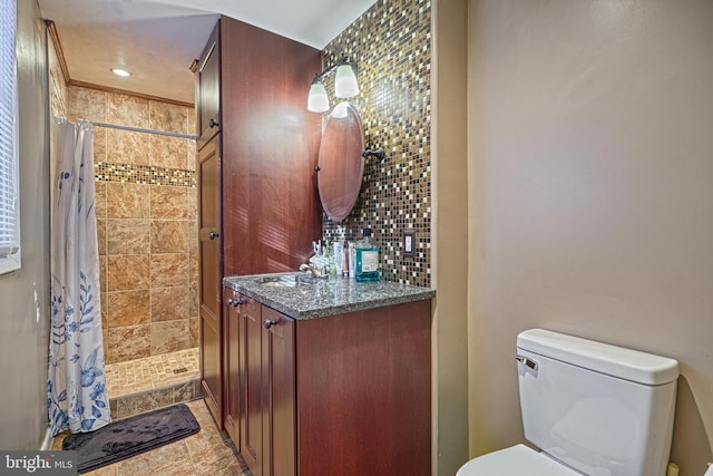 bathroom with vanity, curtained shower, and toilet