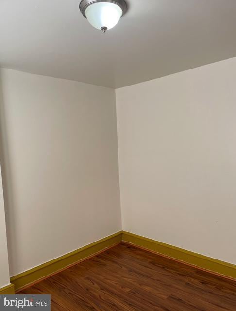 spare room featuring dark hardwood / wood-style floors