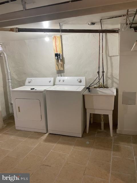 laundry area with independent washer and dryer