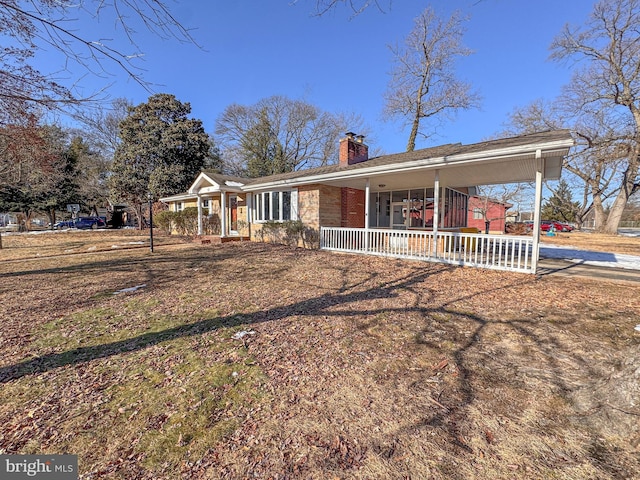 ranch-style home featuring a porch