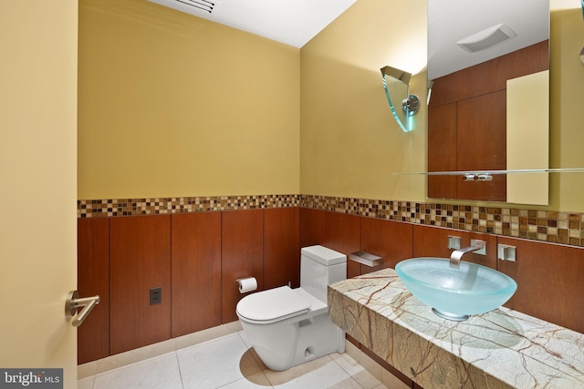 bathroom with tile patterned floors, toilet, and vanity