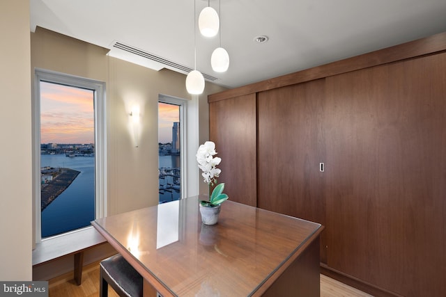 dining space with light hardwood / wood-style flooring