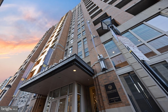 view of outdoor building at dusk