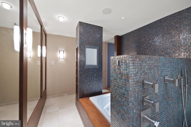 bathroom featuring plus walk in shower and tile patterned floors