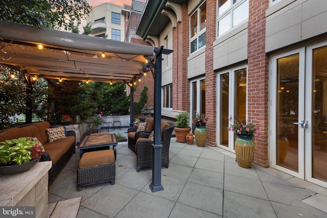 view of patio / terrace with an outdoor living space and a pergola