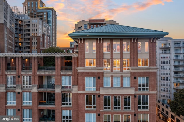 view of outdoor building at dusk