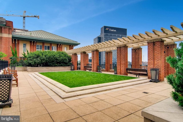 view of community with a lawn and a pergola