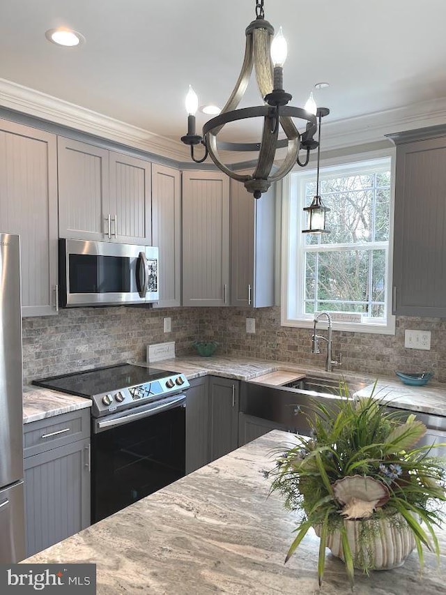 1394 B And A Blvd, Arnold, MD 21012 - kitchen with appliances with stainless steel finishes, gray cabinetry, a chandelier, light stone countertops, and a sink