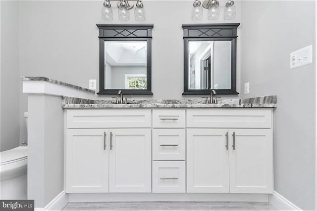 1394 B And A Blvd, Arnold, MD 21012 - full bath with double vanity, baseboards, toilet, and wood finished floors