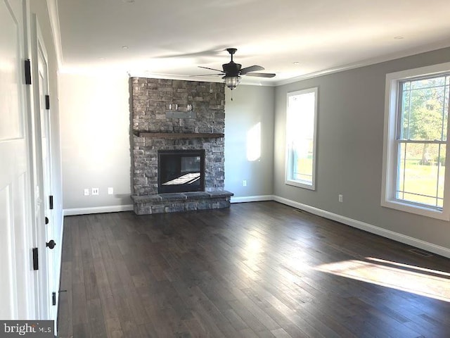 1394 B And A Blvd, Arnold, MD 21012 - unfurnished living room with healthy amount of natural light, crown molding, dark wood-style floors, a stone fireplace, and baseboards