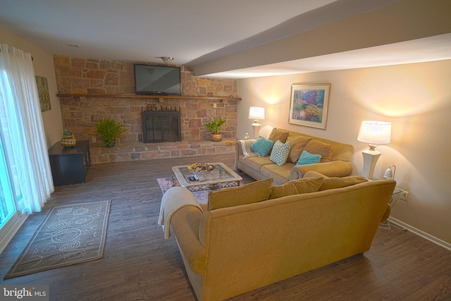 living room featuring dark hardwood / wood-style flooring and a fireplace