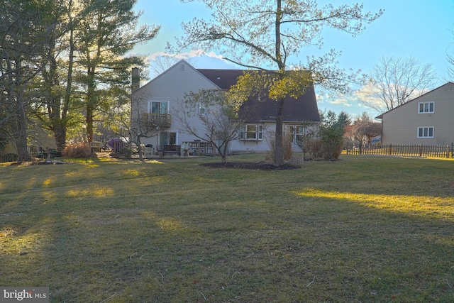 view of side of property featuring a yard