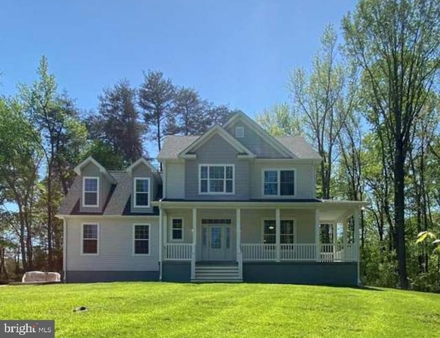 view of front of house featuring covered porch and a front lawn