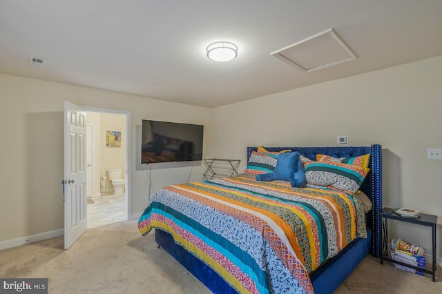 carpeted bedroom with ensuite bath