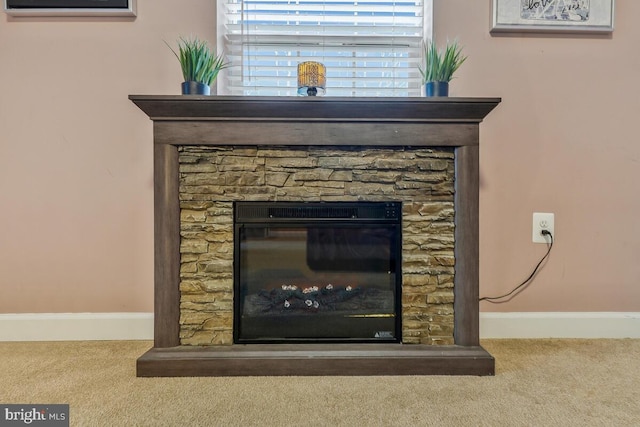 interior details featuring carpet and a fireplace