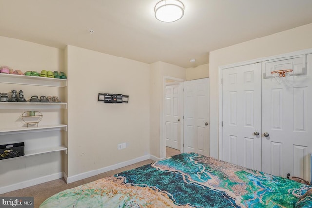 bedroom with light carpet and a closet