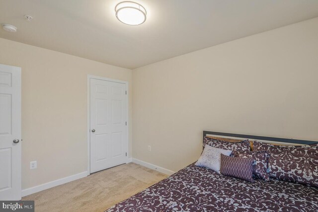 bedroom with light carpet