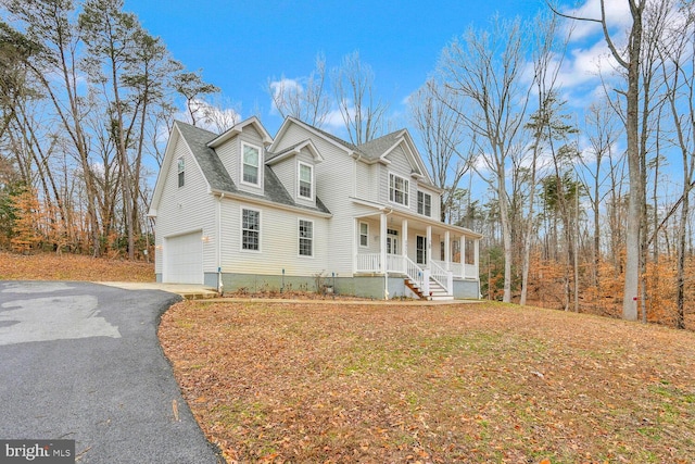 view of front of house featuring a garage and covered porch