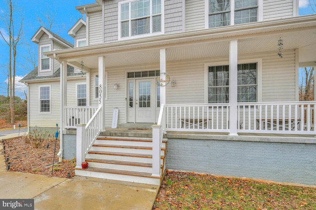 entrance to property featuring a porch