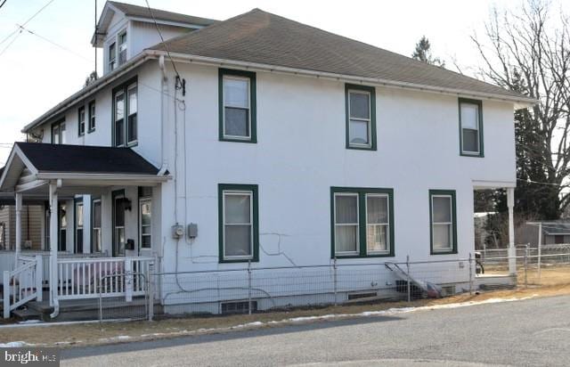 view of property exterior featuring a porch