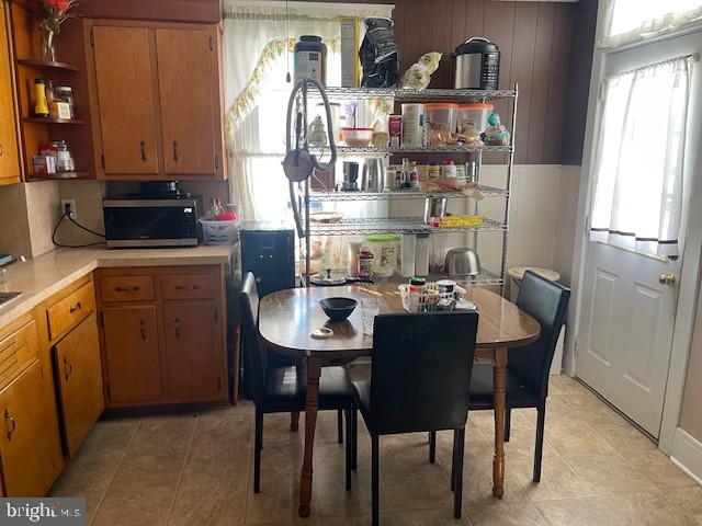 kitchen with light tile patterned flooring