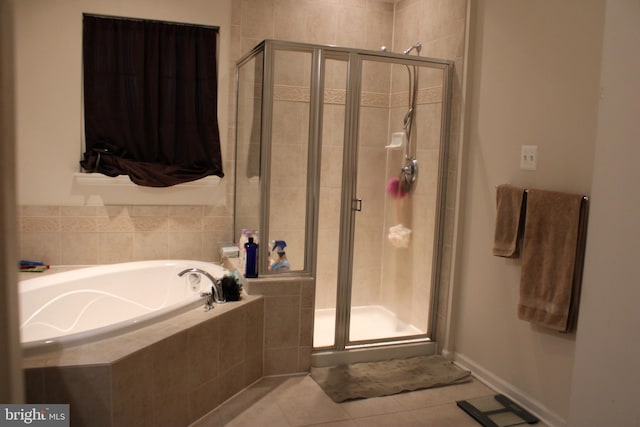 bathroom with tile patterned floors and plus walk in shower