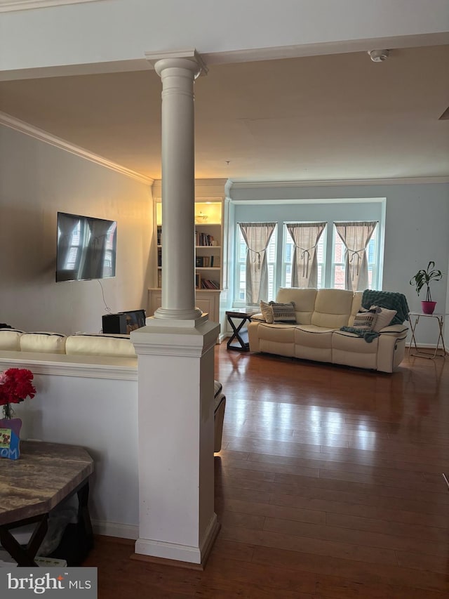 living room featuring ornate columns, ornamental molding, and dark hardwood / wood-style flooring