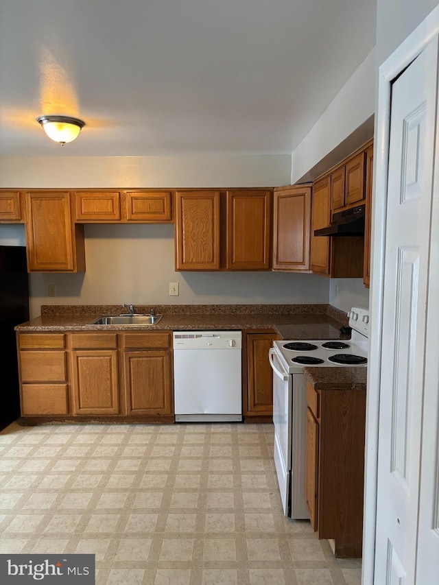 kitchen with sink and white appliances