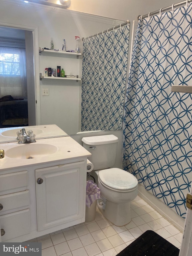 bathroom with vanity, tile patterned floors, and toilet