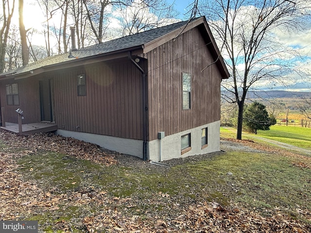 view of property exterior featuring a lawn