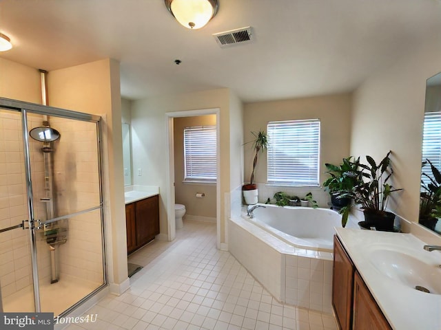 full bathroom with vanity, tile patterned flooring, plus walk in shower, and toilet