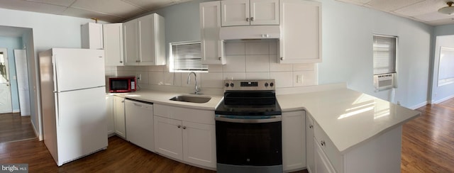 kitchen featuring white appliances, dark hardwood / wood-style flooring, sink, and white cabinets