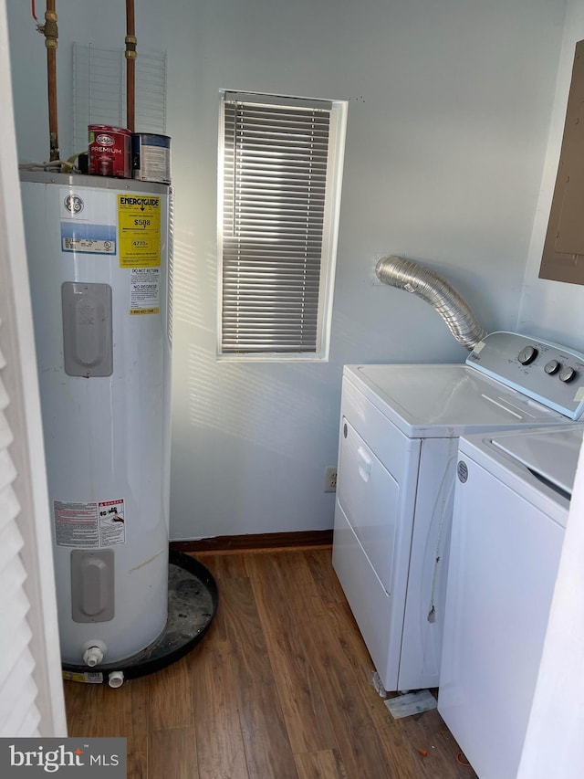 laundry area featuring electric panel, dark hardwood / wood-style flooring, separate washer and dryer, and electric water heater