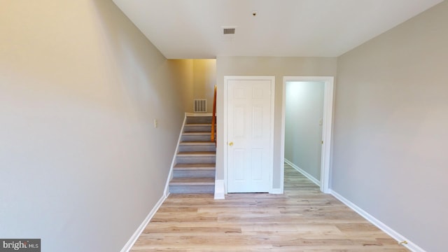 staircase featuring hardwood / wood-style flooring