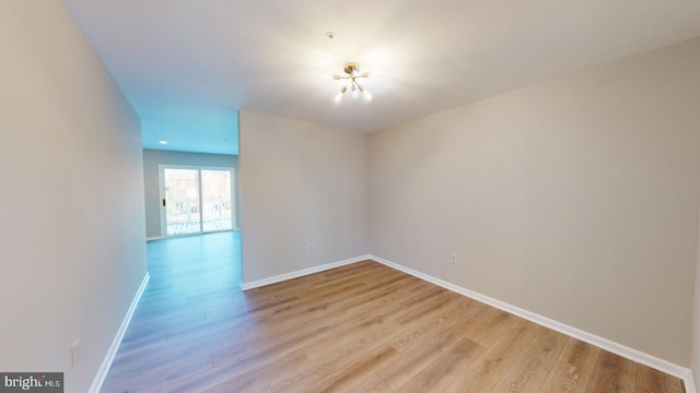 spare room with light hardwood / wood-style flooring