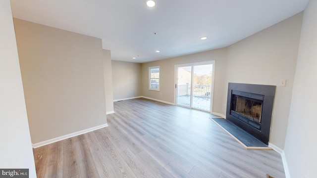 unfurnished living room with light hardwood / wood-style flooring