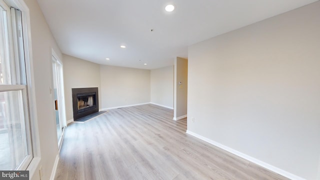 unfurnished living room featuring light wood-type flooring