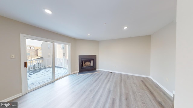 unfurnished living room featuring light hardwood / wood-style flooring