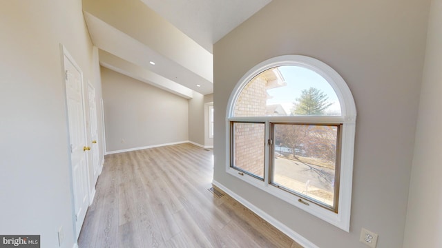 interior space with light hardwood / wood-style flooring and a wealth of natural light