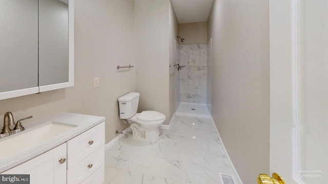 bathroom with vanity, toilet, and walk in shower