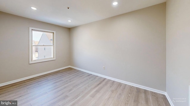 empty room with light wood-type flooring