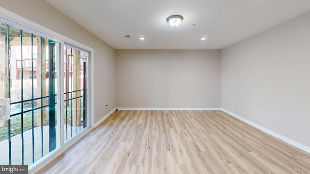 spare room with light wood-type flooring