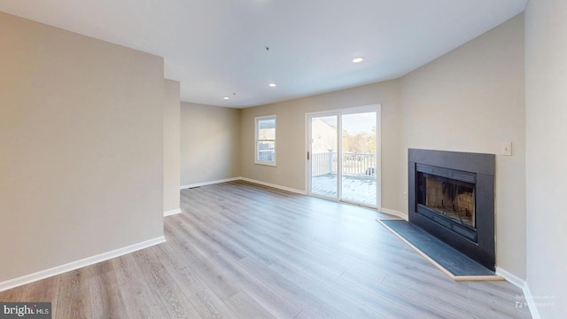 unfurnished living room with light hardwood / wood-style floors