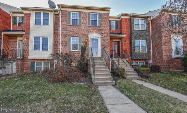 view of property with a front lawn