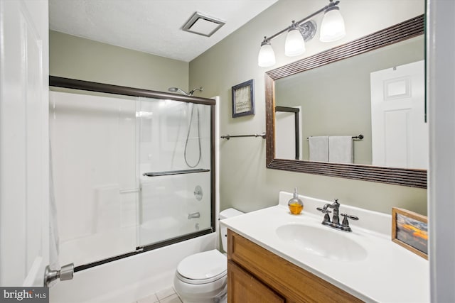 full bathroom featuring enclosed tub / shower combo, vanity, a textured ceiling, and toilet