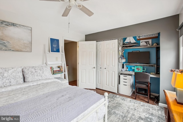 bedroom with wood-type flooring, a closet, and ceiling fan