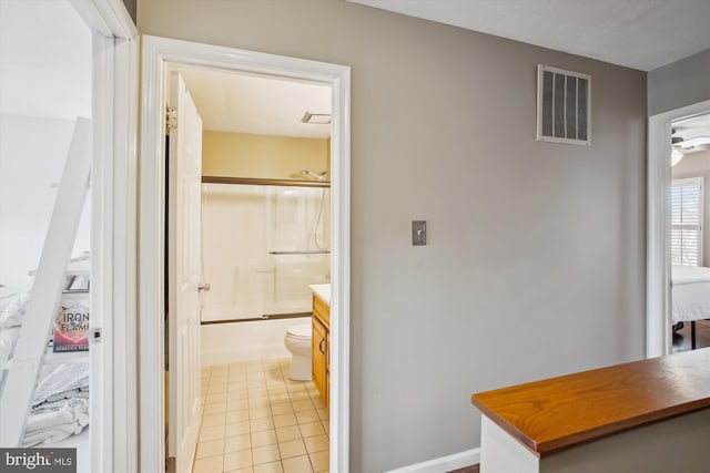 corridor featuring light tile patterned floors