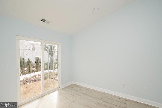 empty room with light hardwood / wood-style floors