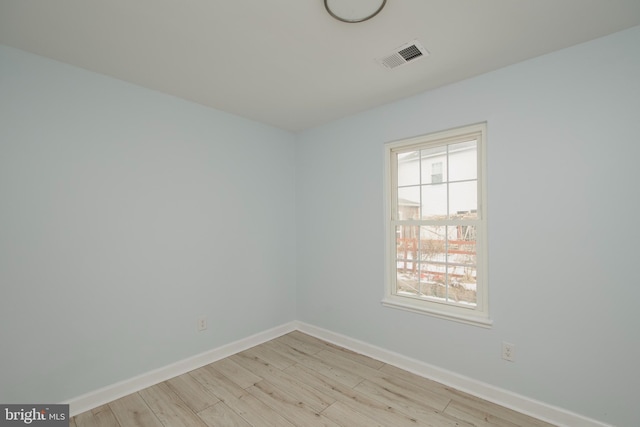 unfurnished room with light hardwood / wood-style floors