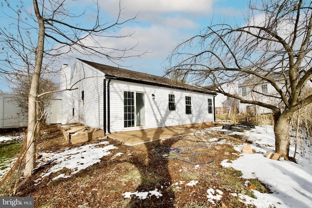 view of snow covered house